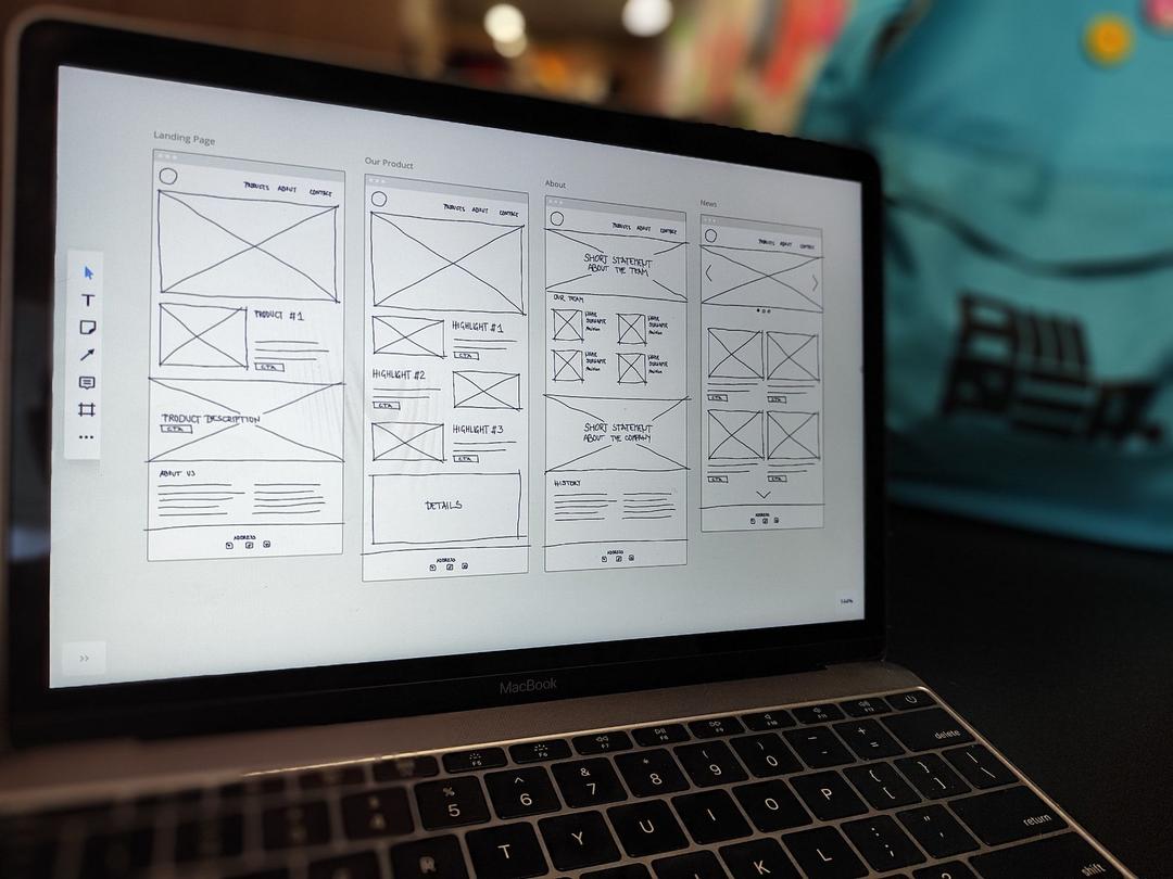 Laptop with wireframes on screen