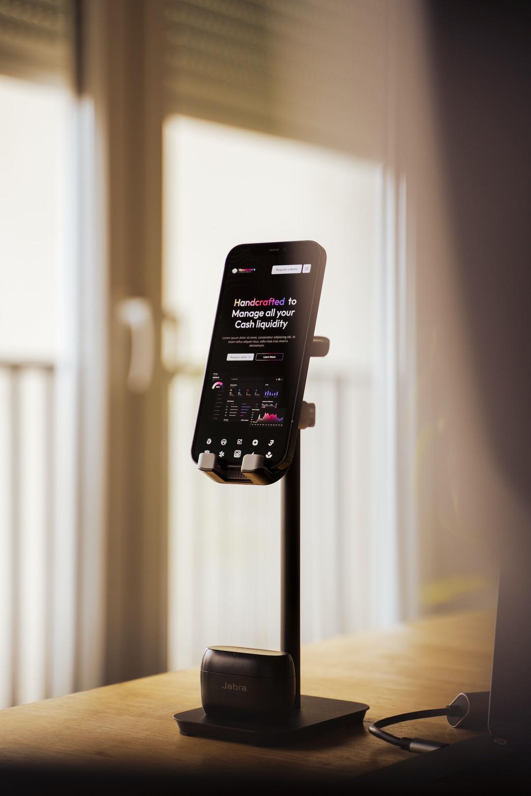 phone on a stand on a desk